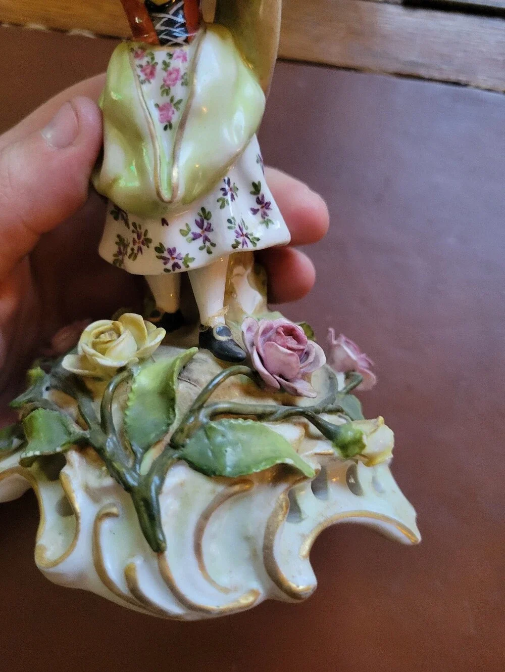 antique porcelain figurine, likely German from around 1900-repaired